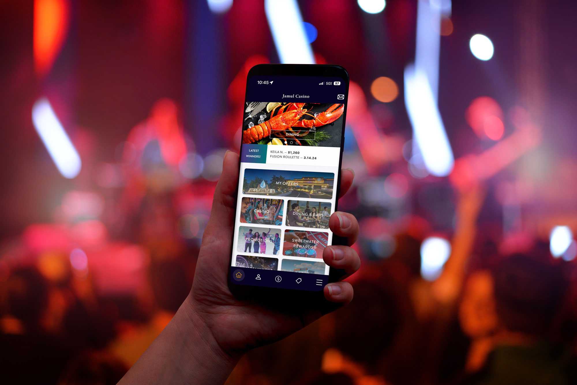Jamul Casino Resort app open on a phone at a concert.