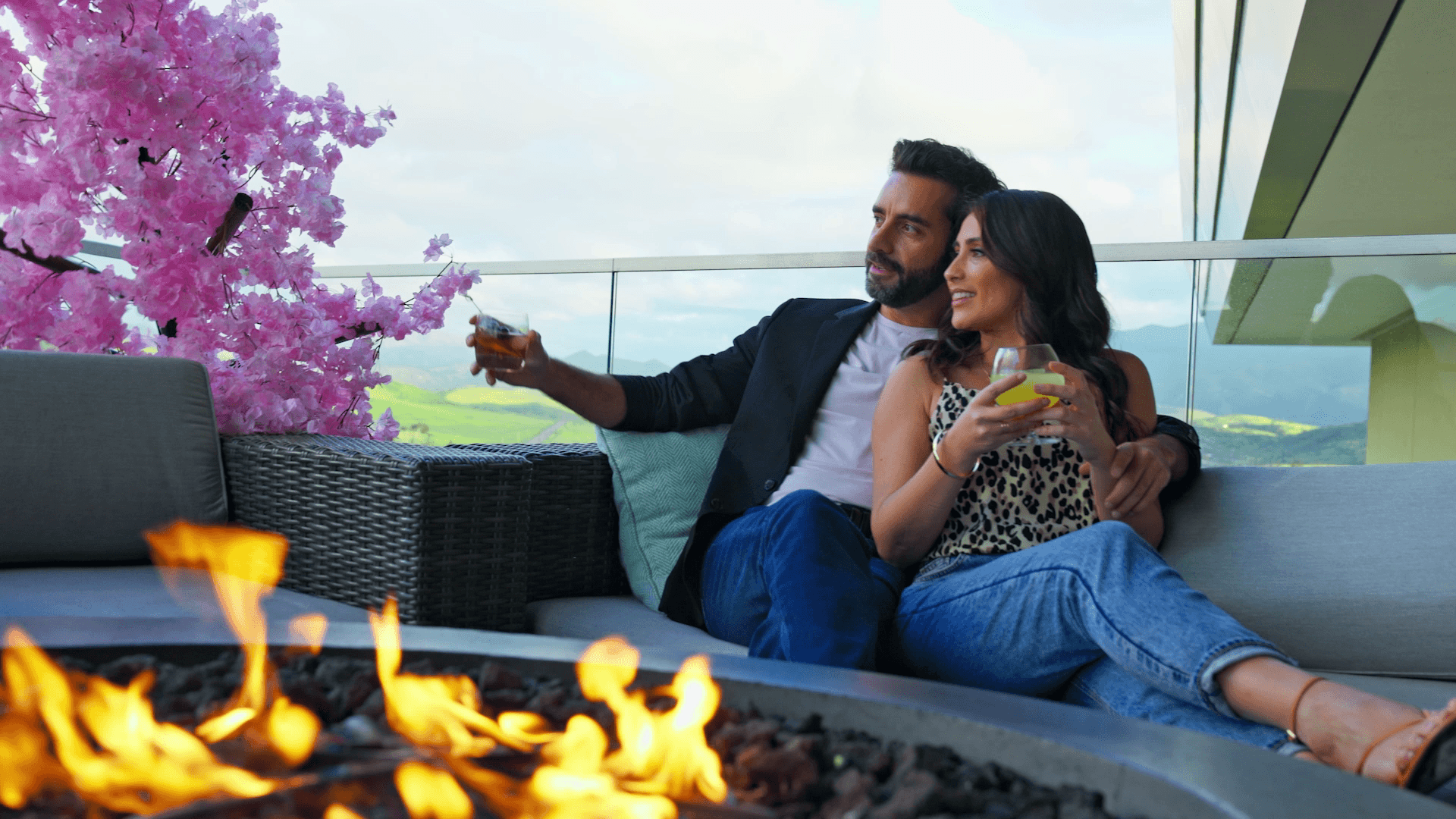 A couple enjoying drinks on the Loft 94 patio